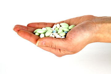 Image showing left hand with pills for healthcare