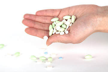 Image showing left hand with pills for healthcare