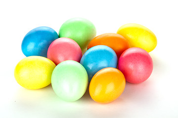 Image showing eastern eggs in different colours in a basket with a rabbit