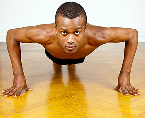 Image showing young man with black skin ist doing fittness