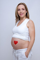Image showing older pregnant woman looks forward to her baby
