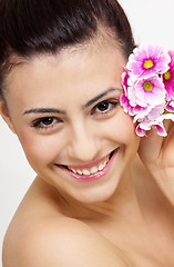 Image showing young beautiful brunette woman with flower
