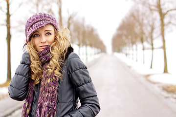 Image showing young woman outside in winter in snow cold