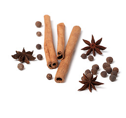Image showing Cinnamon sticks, anise stars and black peppercorns