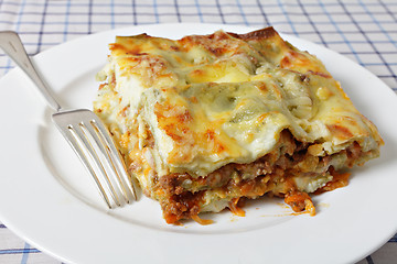 Image showing Lasagne slice with fork