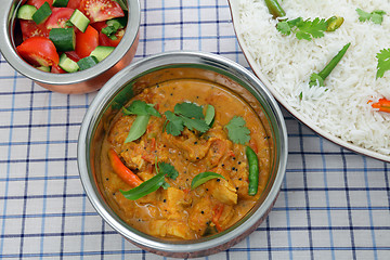 Image showing Chicken curry serving bowls from above