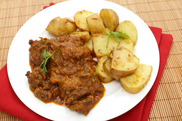 Image showing High angle view beef and potato curries