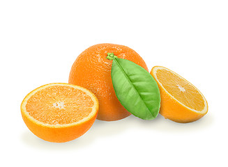 Image showing Heap of fresh orange with green leaf