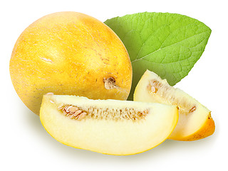 Image showing fresh yellow melon with green leaf