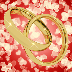 Image showing Gold Rings On Heart Bokeh Background Representing Love Valentine