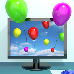 Image showing Festive Colorful Balloons In The Sky And Coming Out Of Screen Fo