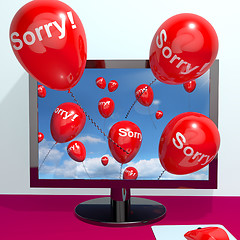 Image showing Sorry Balloons From Computer Showing Online Apology Regret Or Re