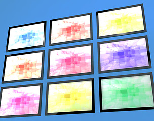 Image showing Nine TV Monitors Wall Mounted In Different Colors Representing H