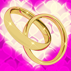 Image showing Gold Rings On Pink Heart Bokeh Background Representing Love Vale