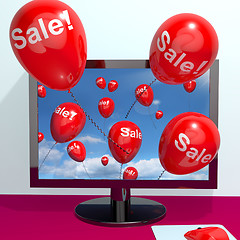 Image showing Sale Balloons Coming From Computer Showing Internet Promotion Di