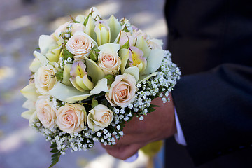 Image showing Man hold flowers