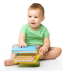 Image showing Portrait of a cute little boy with books
