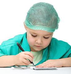 Image showing Cute little girl is playing doctor