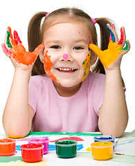 Image showing Portrait of a cute girl with painted hands