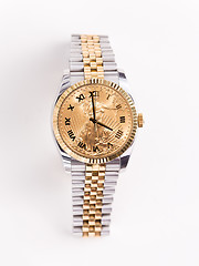 Image showing Gold and stainless steel mans watch