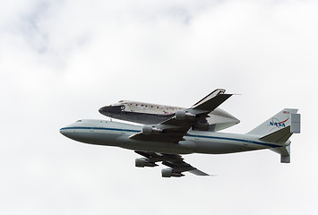 Image showing Space Shuttle Discovery flies over Washington