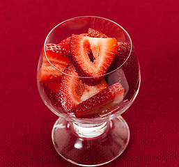 Image showing Fresh sliced strawberries in glass dish