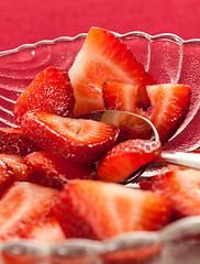 Image showing Fresh sliced strawberries in glass dish