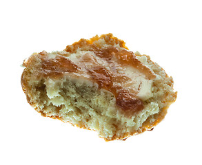 Image showing Half scone with butter and jam isolated