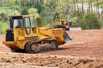 Image showing Large earth mover digger clearing land