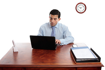 Image showing Businessman iworking at office desk