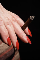 Image showing Smoking a Small Cigar