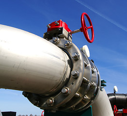 Image showing Industrial zone, Steel pipelines and valves against blue sky