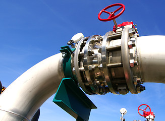 Image showing Industrial zone, Steel pipelines and valves against blue sky