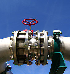 Image showing Industrial zone, Steel pipelines and valves against blue sky