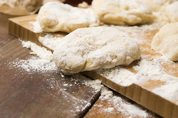 Image showing Dough on wooden board