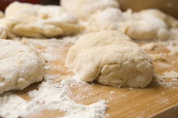 Image showing Dough on wooden board