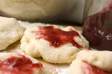 Image showing Dough with marmelade on wooden board