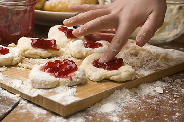 Image showing Detail of hands kneading dough