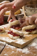 Image showing Detail of hands kneading dough