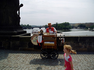 Image showing Prague Karlsbridge one man band and girl