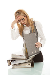 Image showing business woman with folder on desk workin isolated on white background