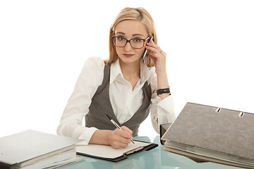 Image showing business woman with folder on desk workin isolated on white background