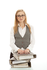 Image showing business woman with folder on desk workin isolated on white background