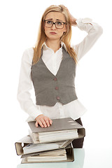 Image showing business woman with folder on desk workin isolated on white background