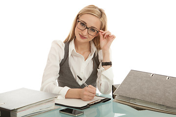 Image showing business woman with folder on desk workin isolated on white background