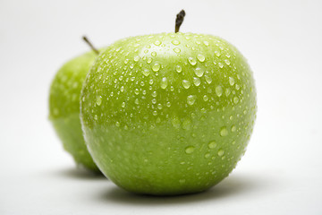 Image showing Two Green Apples w/ Raindrops (Side View)