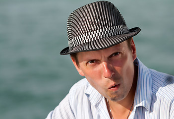 Image showing portrait of a man in a hat amazed