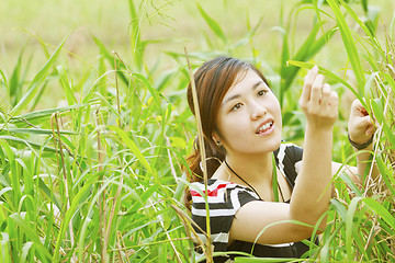 Image showing Asian woman in the grasses