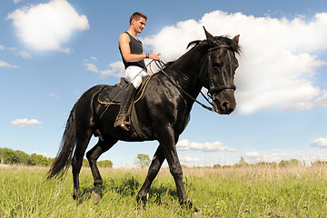 Image showing young man and horse