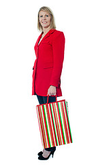 Image showing Beautiful senior lady holding shopping bag